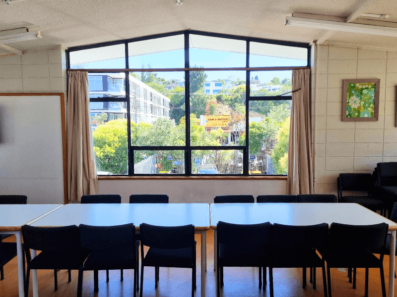 View of big window and tables in meeting room 1 - one of our largest rooms available